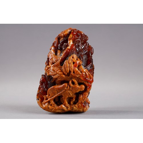 Pendant in amber root finely carved with a buffalo and several characters in a landscape - China 19th century